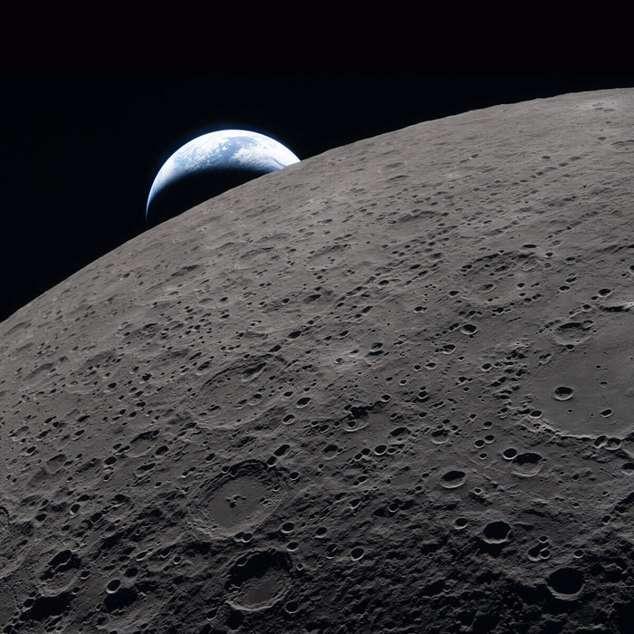 Earth setting behind the lunar surface with Ohm crater in the foreground, photographed by Artemis II three minutes before loss of signal