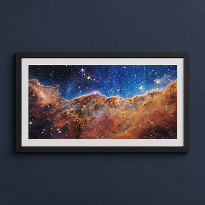 Framed print mockup — Cosmic Cliffs Carina Nebula Full Panorama