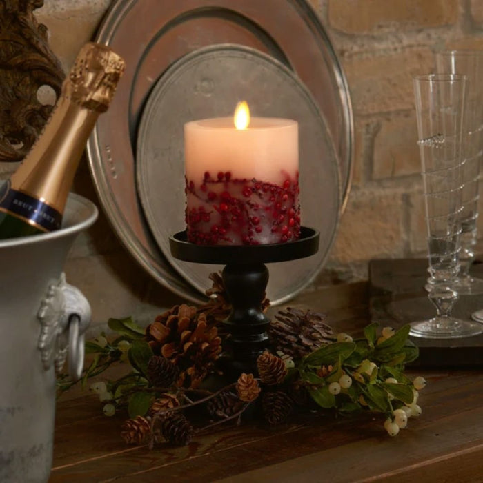 This Luminara Red Berry Inclusions Flameless Pillar is the fashion-forward centerpiece for all your candle décor needs. We selected this modern melted design to showcase the dancing Real-Flame Effect from all angles, ensuring endless decorating possibilities!