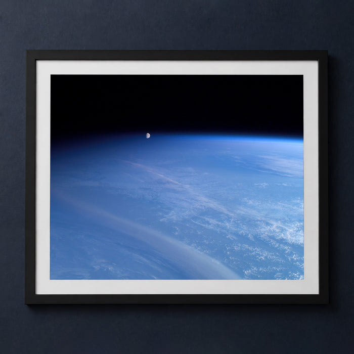 Framed print mockup — Moonset above Earth