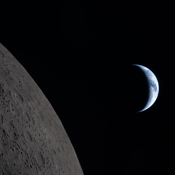 A crescent Earth about to set behind the Moon photographed by the Artemis II crew six minutes before Earthset